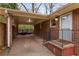 Brick carport with access to a deck and hot tub at 491 Monument Se Ave, Atlanta, GA 30316