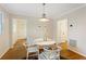 Charming dining room with hardwood floors and whitewashed furniture at 491 Monument Se Ave, Atlanta, GA 30316