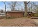 Brick house with deck and surrounding trees at 491 Monument Se Ave, Atlanta, GA 30316