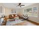 Living room features hardwood floors, a large window, and a cozy seating area at 491 Monument Se Ave, Atlanta, GA 30316
