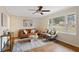 Living room with hardwood floors, neutral decor, and large windows at 491 Monument Se Ave, Atlanta, GA 30316