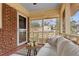 Cozy screened porch with seating and view of backyard at 491 Monument Se Ave, Atlanta, GA 30316