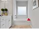 Bathroom featuring a white bathtub and a double vanity at 205 Bastian Dr # 2, Villa Rica, GA 30180