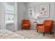 Bedroom sitting area with two orange accent chairs at 205 Bastian Dr # 2, Villa Rica, GA 30180