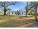 House with detached garage and large grassy yard at 2711 Mcdonough Rd, Hampton, GA 30228