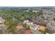 Wide aerial view of homes nestled among mature trees in a quiet, wooded neighborhood at 4267 Matisse Ln, Fairburn, GA 30213