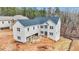 Aerial view of a new house with a two car garage at 4267 Matisse Ln, Fairburn, GA 30213