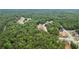 Overhead view of the neighborhood shows lush tree coverage and a view of several residential homes at 4267 Matisse Ln, Fairburn, GA 30213