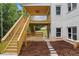 Backyard with stairs to covered porch and brick exterior at 4267 Matisse Ln, Fairburn, GA 30213