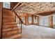 Unfinished basement with exposed ceiling joists, offering a blank canvas for customization at 4267 Matisse Ln, Fairburn, GA 30213