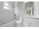 Modern bathroom with white subway tile, bathtub, shower, and vanity with a marble countertop at 4267 Matisse Ln, Fairburn, GA 30213
