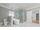 Bathroom featuring a glass enclosed shower, soaking tub, and toilet at 4267 Matisse Ln, Fairburn, GA 30213