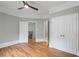 Bedroom showcasing wood floors, large closets, and views of the staircase and hallway at 4267 Matisse Ln, Fairburn, GA 30213