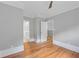 Bedroom view showcasing wood floors and views to the bathroom and hallway at 4267 Matisse Ln, Fairburn, GA 30213