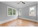 Cozy bedroom features hardwood floors, natural light, and neutral paint, creating a serene atmosphere at 4267 Matisse Ln, Fairburn, GA 30213