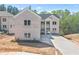 Stunning two-story home with a white brick exterior and a long private driveway at 4267 Matisse Ln, Fairburn, GA 30213