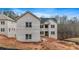 Exterior view of a two-story home with light brick and a long driveway at 4267 Matisse Ln, Fairburn, GA 30213