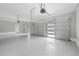 Spacious three-car garage with epoxy floors, modern doors with windows and automatic door openers at 4267 Matisse Ln, Fairburn, GA 30213