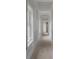 Long hallway under construction showcasing new trim and windows, ready for completion at 4267 Matisse Ln, Fairburn, GA 30213