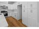 Well-lit kitchen features white cabinets, stainless steel appliances, and marble countertops at 4267 Matisse Ln, Fairburn, GA 30213