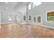 Bright living room with hardwood floors, recessed lights, and high ceilings with multiple windows at 4267 Matisse Ln, Fairburn, GA 30213