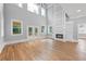 Bright, open living room with high ceilings, large windows, and a modern fireplace at 4267 Matisse Ln, Fairburn, GA 30213