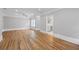 Expansive living room featuring hardwood floors, recessed lighting, and doorway views to the bathroom at 4267 Matisse Ln, Fairburn, GA 30213