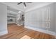 Spacious living room with hardwood floors, custom trim and staircase and an open concept design at 4267 Matisse Ln, Fairburn, GA 30213