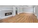 Bright living room features a modern fireplace, hardwood floors, and neutral paint at 4267 Matisse Ln, Fairburn, GA 30213