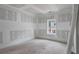 Partially finished room with a window, showcasing the potential for customization at 4267 Matisse Ln, Fairburn, GA 30213