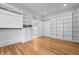 Spacious walk-in closet with hardwood floors and built-in shelving at 4267 Matisse Ln, Fairburn, GA 30213