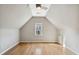 Attic space featuring hardwood floors and natural light at 2669 Glenrose Hl, Atlanta, GA 30341