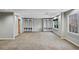 Spacious finished basement with neutral carpet and built-in shelving at 2669 Glenrose Hl, Atlanta, GA 30341