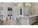 Bright bathroom featuring a glass shower, tub, double sink vanity, and white cabinets at 2669 Glenrose Hl, Atlanta, GA 30341
