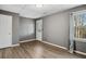 Neutral bedroom with private entry door and large window at 2669 Glenrose Hl, Atlanta, GA 30341