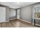 Basement bedroom with vinyl plank flooring and exterior access at 2669 Glenrose Hl, Atlanta, GA 30341