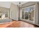 Bright dining area with hardwood floors and large window overlooking backyard at 2669 Glenrose Hl, Atlanta, GA 30341