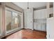 Bright dining area with hardwood floors, large window, and white trim at 2669 Glenrose Hl, Atlanta, GA 30341