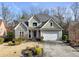 Charming home featuring stone accents, neutral paint, and a well-manicured lawn at 2669 Glenrose Hl, Atlanta, GA 30341