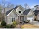 Charming home featuring stone accents, neutral paint, and mature trees at 2669 Glenrose Hl, Atlanta, GA 30341