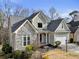 Two-story house with stone accents and a large driveway at 2669 Glenrose Hl, Atlanta, GA 30341