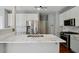 Kitchen featuring white cabinets, stainless steel appliances, and marble countertops at 2669 Glenrose Hl, Atlanta, GA 30341