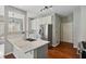 Bright kitchen with marble countertops, stainless steel appliances, and hardwood floors at 2669 Glenrose Hl, Atlanta, GA 30341