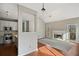 Bright living room featuring hardwood floors, fireplace, and modern lighting at 2669 Glenrose Hl, Atlanta, GA 30341
