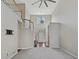 Bright living room with vaulted ceilings, staircase, and an entry door with sidelights at 2669 Glenrose Hl, Atlanta, GA 30341