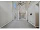Spacious living room with vaulted ceilings, large windows, and an open layout at 2669 Glenrose Hl, Atlanta, GA 30341