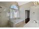 Luxurious bathroom featuring soaking tub, tiled shower, and ample counter space at 2669 Glenrose Hl, Atlanta, GA 30341