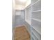 Large walk-in closet with custom built-in shelving at 3060 Pharr Court North Nw # 109, Atlanta, GA 30305