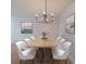 Elegant dining room with a modern chandelier and large dining table at 3060 Pharr Court North Nw # 109, Atlanta, GA 30305