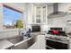 Modern kitchen featuring stainless steel appliances and white cabinetry at 3384 Campbell Se Rd, Smyrna, GA 30080